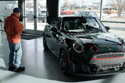 A man looks at a 2024 Cooper S John Cooper Works convertible at a Mini dealership on Nov. 30, 2023, in Loveland, Colo.