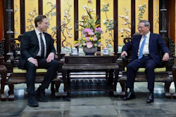 In this photo released by Xinhua News Agency, visiting Tesla founder and CEO Elon Musk, left, meets with Chinese Premier Li Qiang in Beijing, Sunday, April 28, 2024. Musk met with a top government leader in the Chinese capital Sunday, just as the nation's carmakers are showing off their latest electric vehicle models at the Beijing auto show.