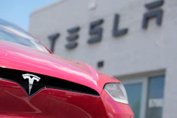 A Model X sports-utility vehicle sits outside a Tesla store in Littleton, Colo., June 18, 2023.