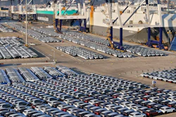 New cars for export wait for transportation on a vehicles carrier vessel at a dockyard in Yantai in east China's Shandong province.