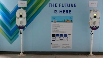 Electric Vehicle charging stations are seen a residential building parking area in Mumbai, India.