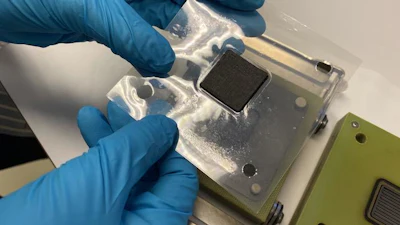 The sample is taken from the cell housing for analysis in a scanning electron microscope after a stress test.