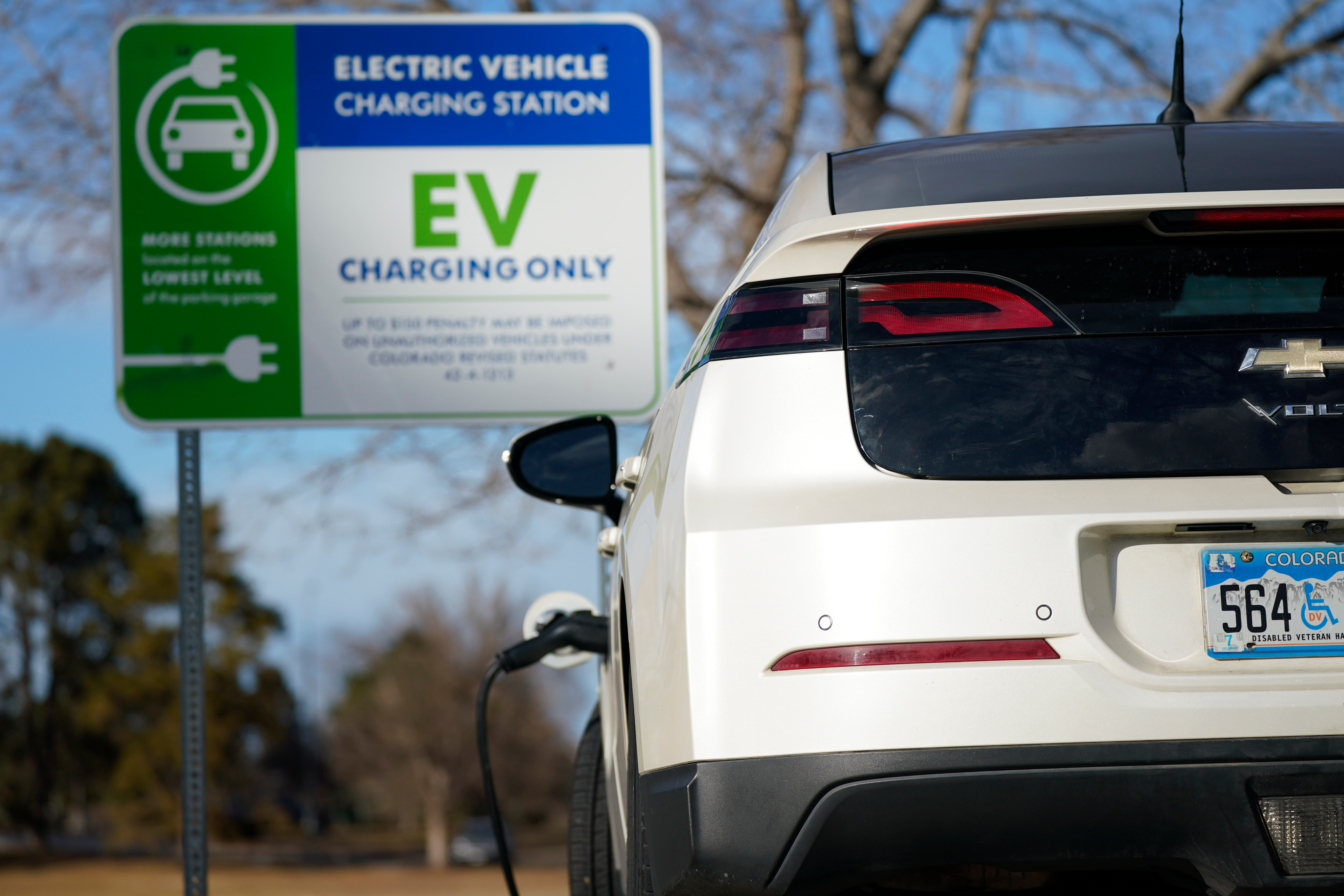 A Chevrolet Volt charges at at a station outside the Denver Museum of Nature and Science Tuesday, Jan. 5, 2020, in east Denver.