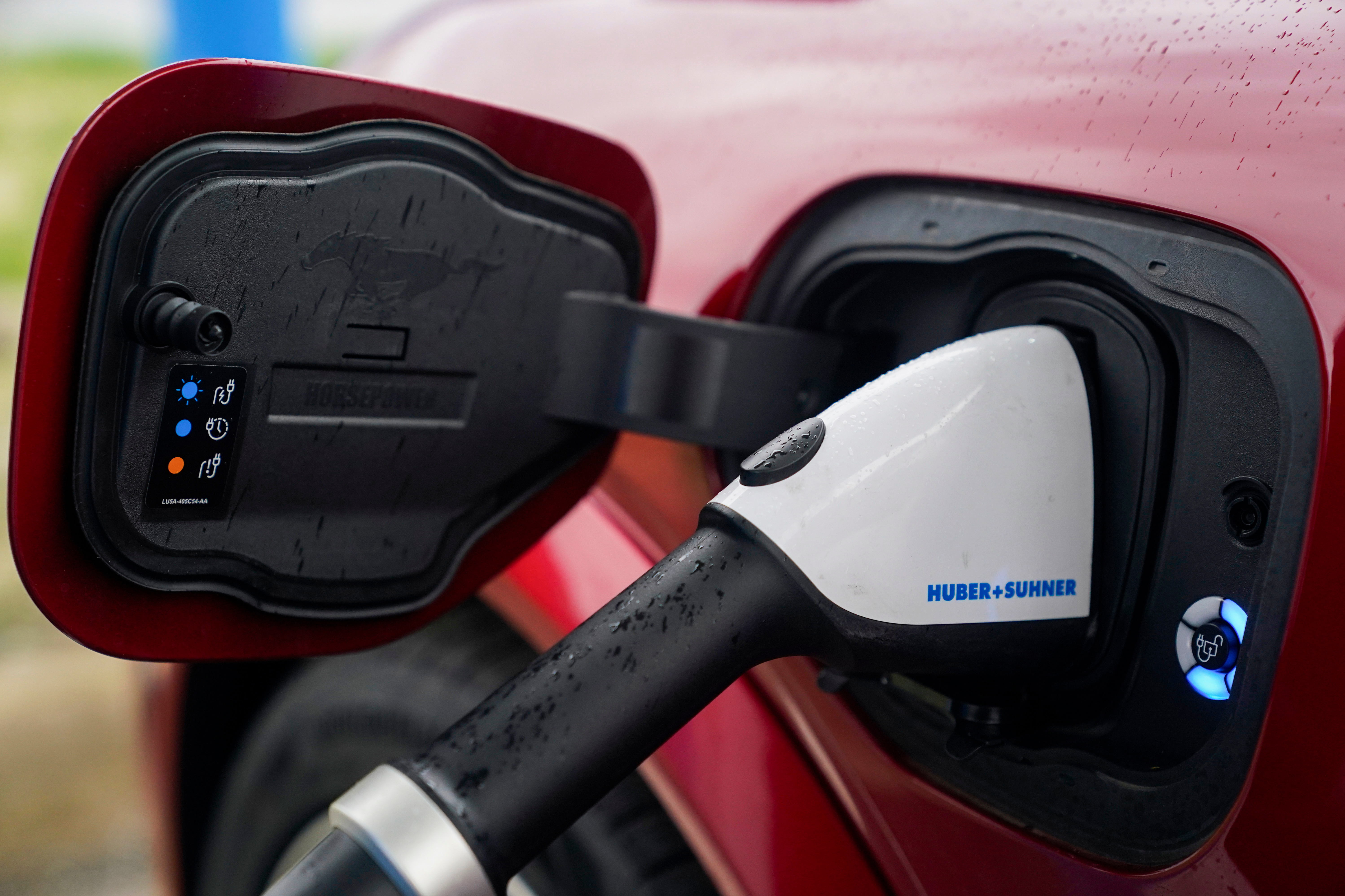A 2023 Ford Mustang Mach-E charges, Friday, March 8, 2024, at an electric vehicle charging station in London, Ohio.