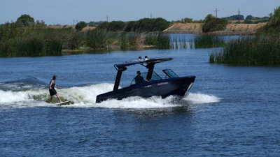 Grant Jeide wake surfs behind an electric sports boat made by California-based Arc Boats on the Sacramento-San Joaquin Delta near Bethel Island, Calif. on Wednesday, July 31, 2024.