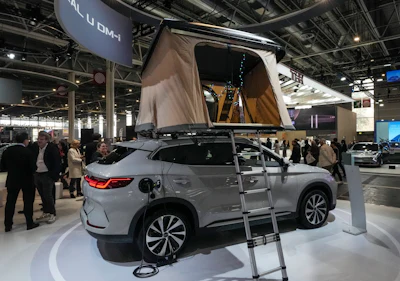 A BYD SEAL U DM-i with a tent on the top is presented at the Paris Auto Show, in Paris, Monday, Oct. 14, 2024.