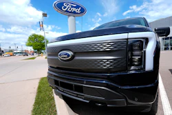 An unsold 2024 Lightning electric pickup truck sits at a Ford dealership May 19, 2024, in Denver.