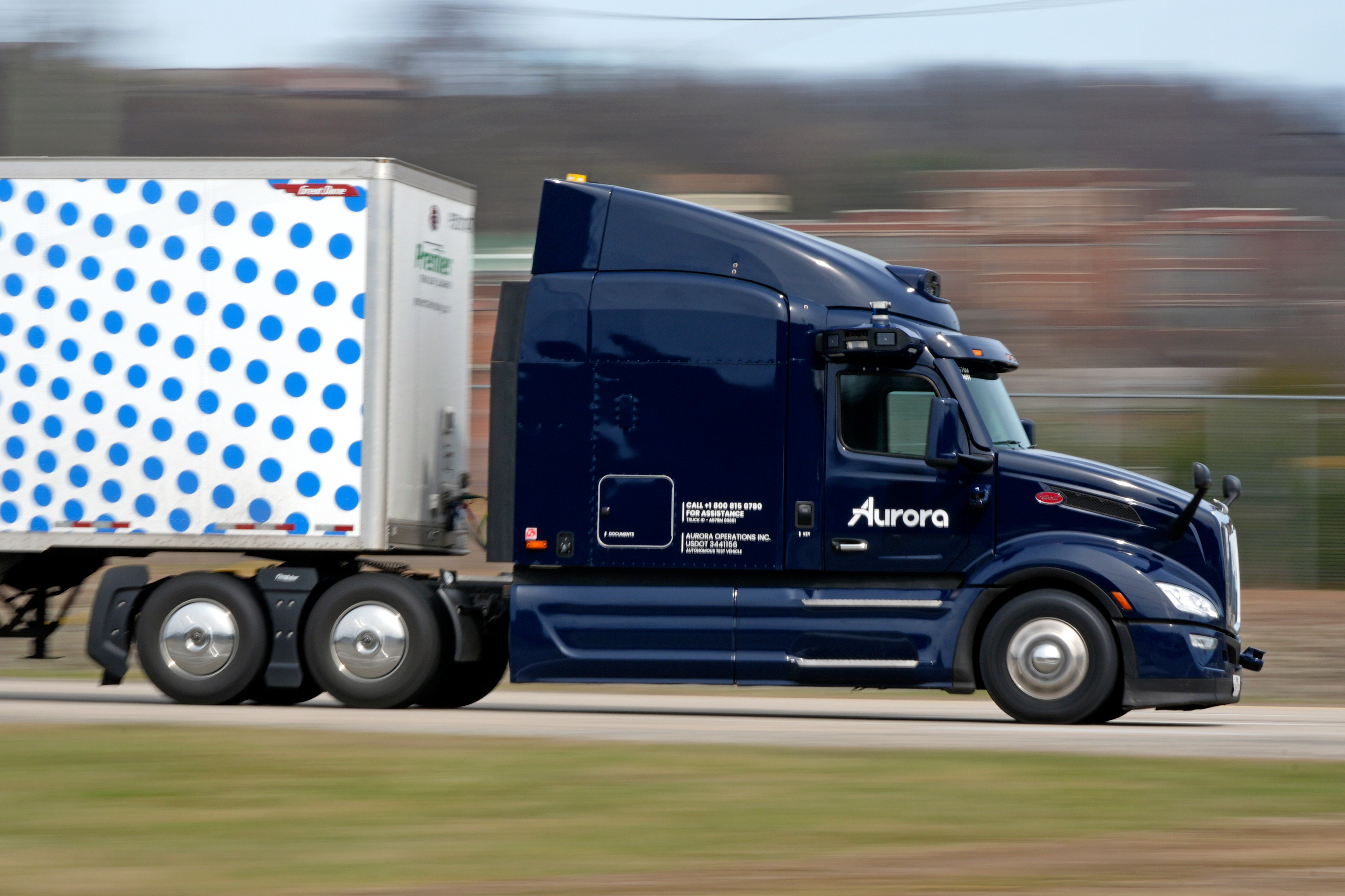 A self-driving tractor trailer maneuvers around a test track in Pittsburgh, Thursday, March 14, 2024. The truck is owned by Pittsburgh-based Aurora Innovation Inc.