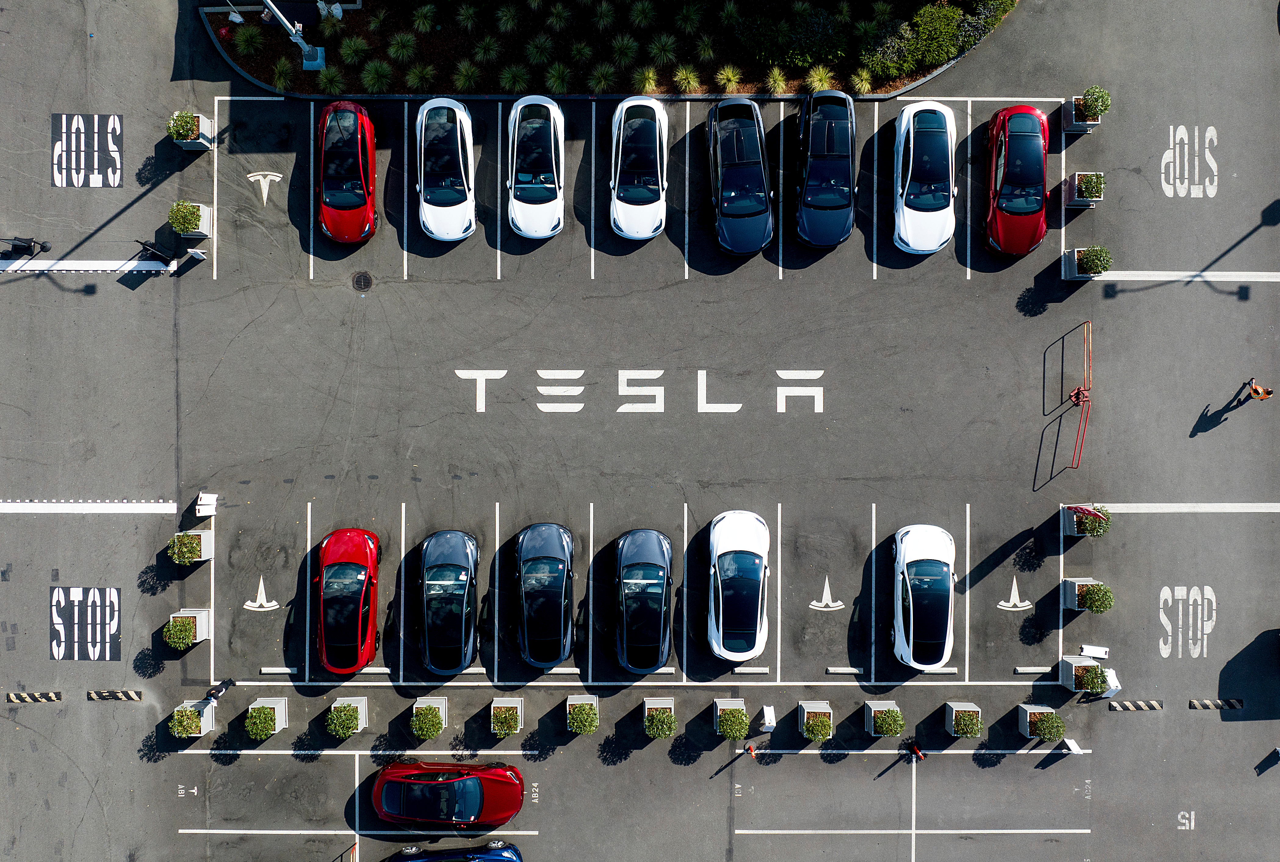 Tesla vehicles line a parking lot at the company's Fremont, Calif., factory, on Sept. 18, 2023.