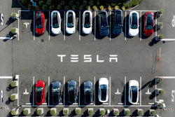 Tesla vehicles line a parking lot at the company's Fremont, Calif., factory, on Sept. 18, 2023.