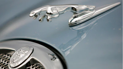 The hood ornament and a portion of the grill of a Jaguar automobile is shown at a dealership in Norwood, Mass. on March 26, 2008.