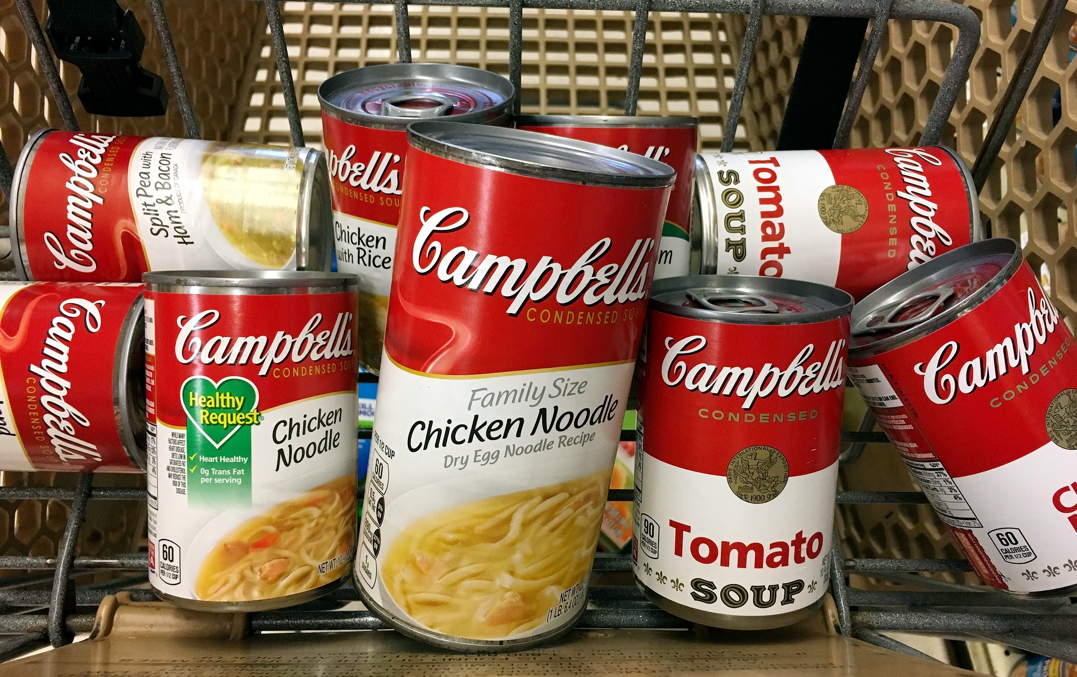 This May 23, 2017, file photo shows a variety of Campbell's soups in a grocery cart at a store in Phoenix.