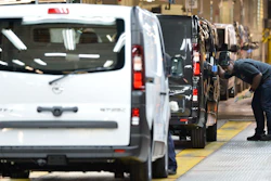 An employee inspects a car at the Vauxhall vehicle production plant in Luton, England, Feb. 2, 2015.