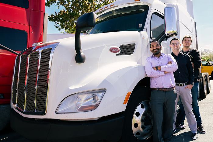 Mechanical and Aerospace Engineering Professor Subith Vasu and students pose with a PACCAR truck that may stand to benefit from Vasu’s hydrogen combustion engine research.