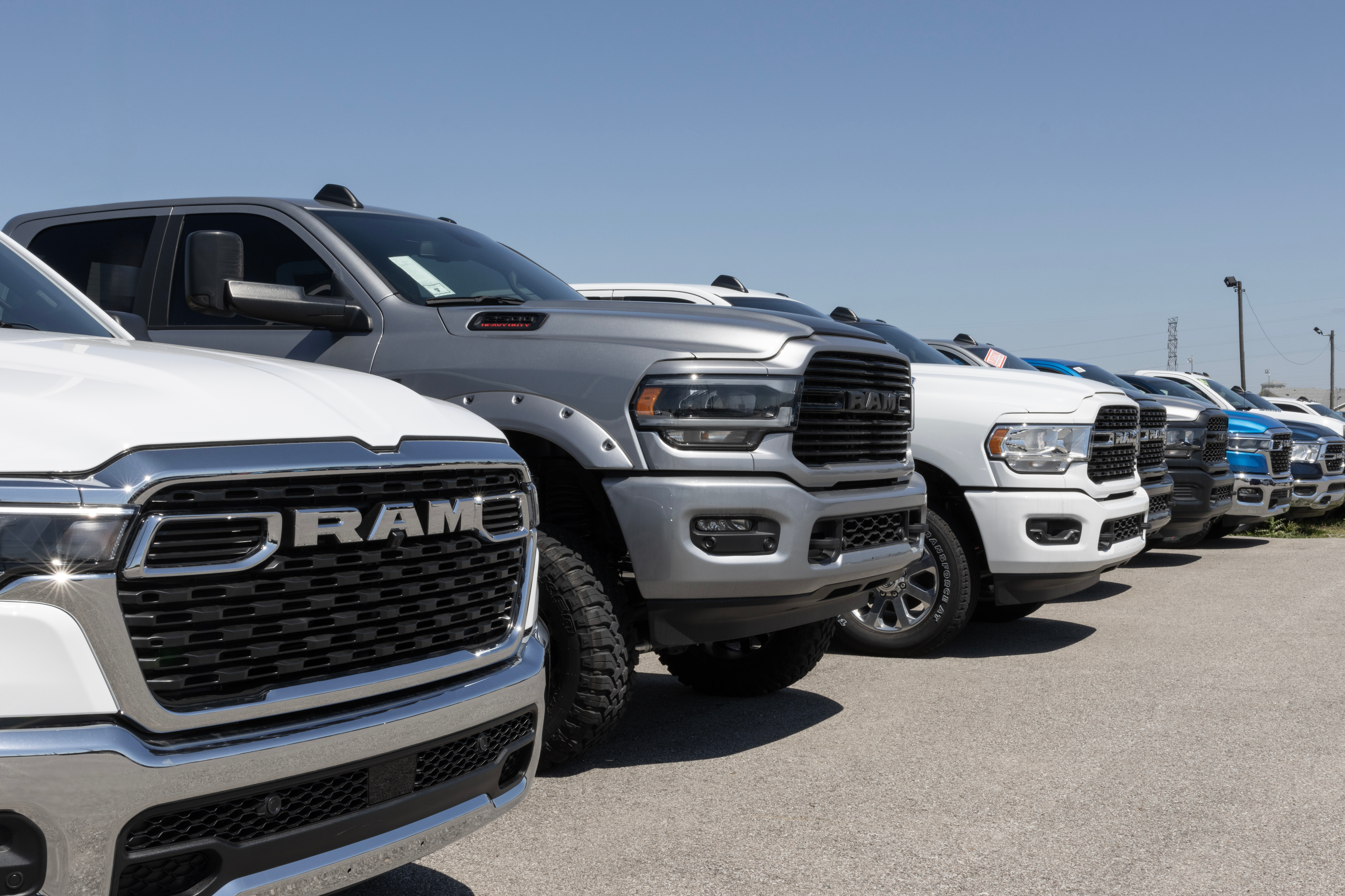 Ram 1500 and 2500 pickup truck display at a dealership.