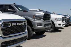 Ram 1500 and 2500 pickup truck display at a dealership.