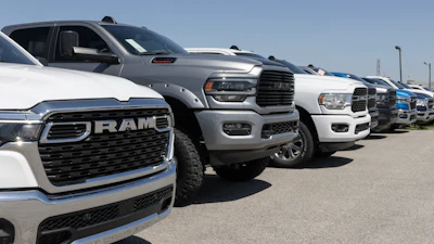 Ram 1500 and 2500 pickup truck display at a dealership.