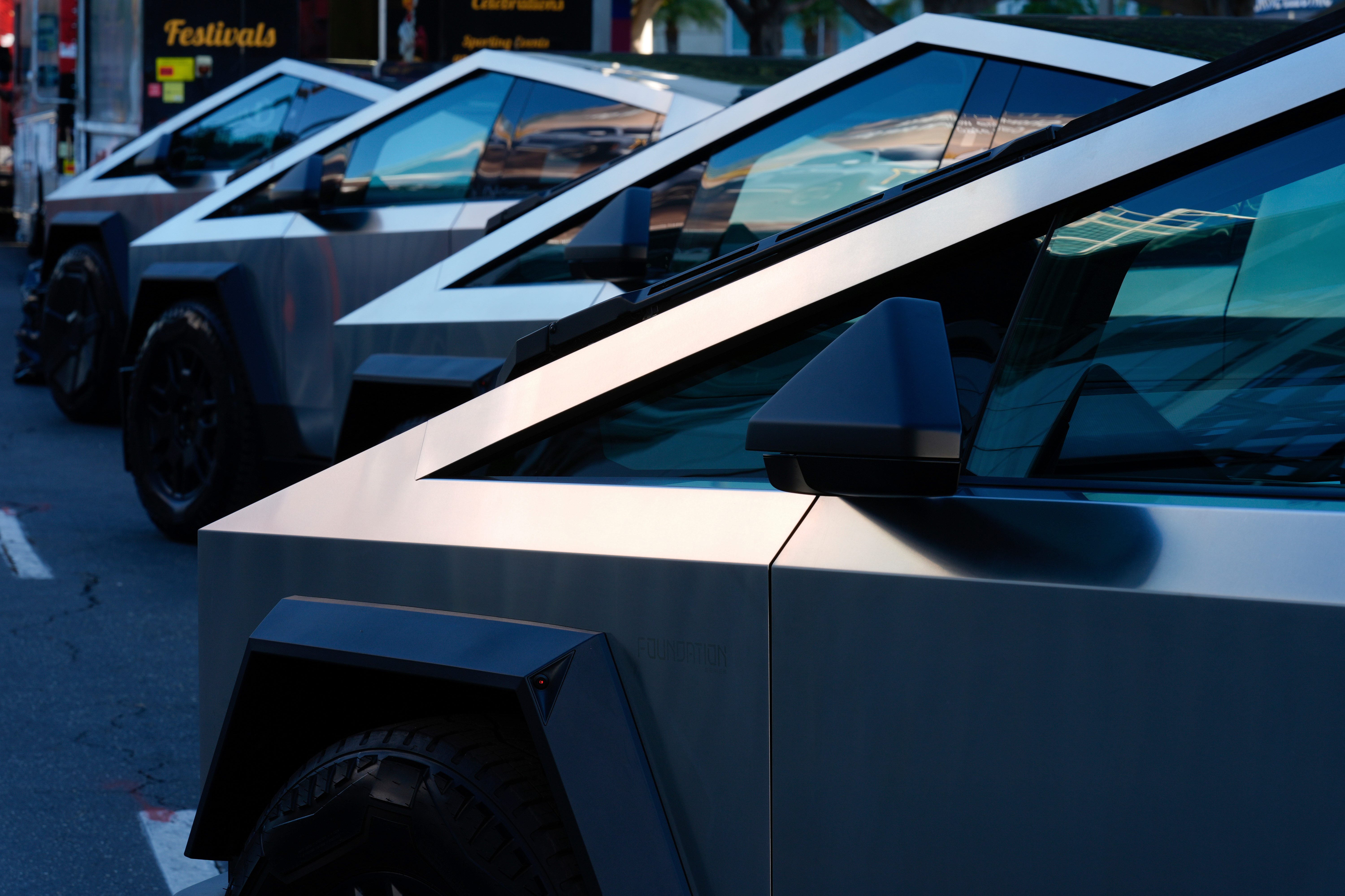 Tesla Cybertrucks are displayed at the AutoMobility LA Auto Show, Nov. 21, 2024, in Los Angeles.