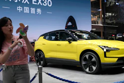 A live streamer works near the Volvo EX30 fully electric small SUV unveiled during Auto China 2024 in Beijing, Thursday, April 25, 2024.