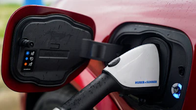 A 2023 Ford Mustang Mach-E charges, March 8, 2024, at an electric vehicle charging station in London, Ohio.