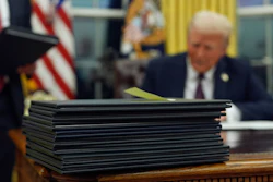 President Donald Trump signs executive orders in the Oval Office of the White House, Jan. 20, 2025, in Washington.