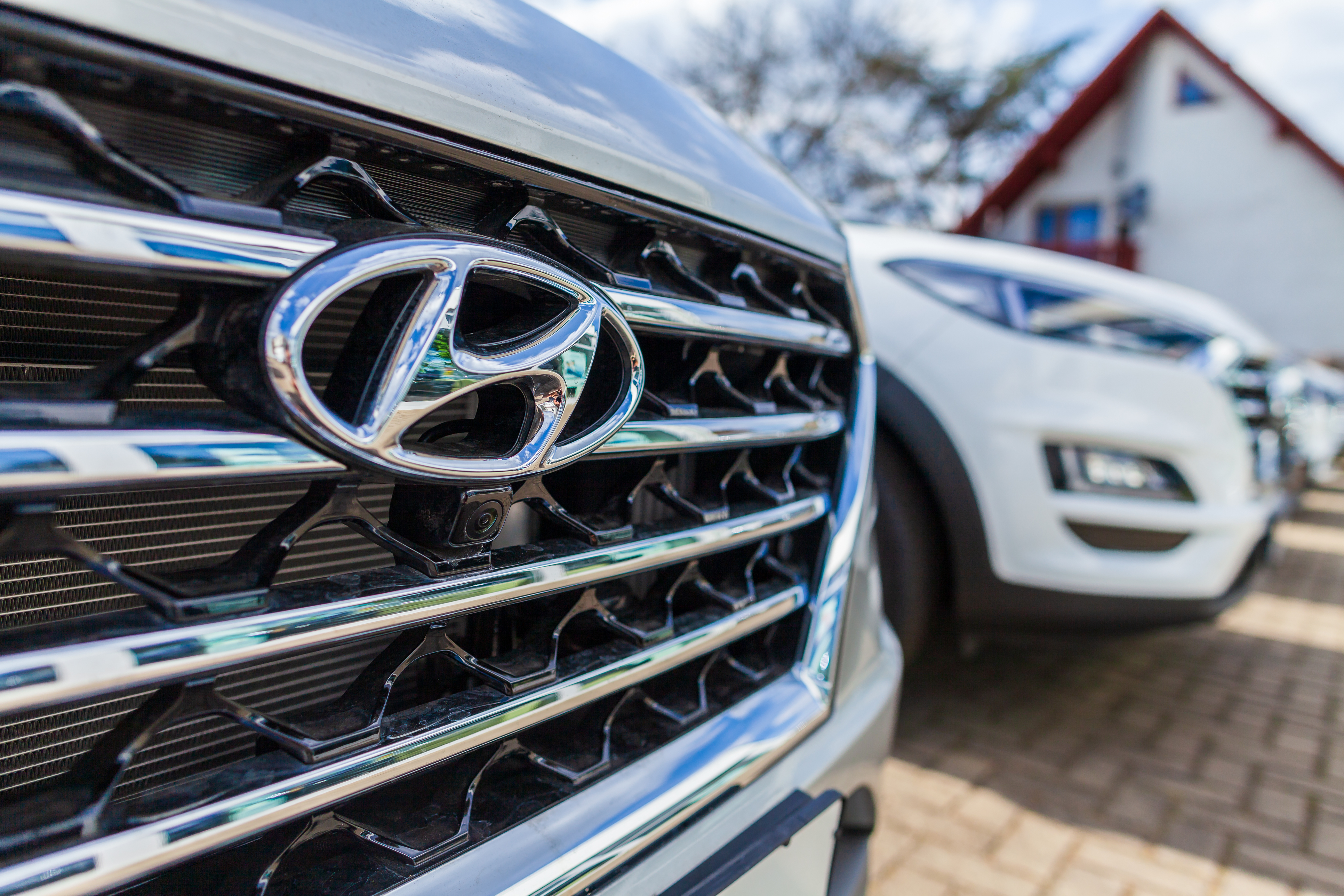 The logo on the grille of a Hyundai vehicle.
