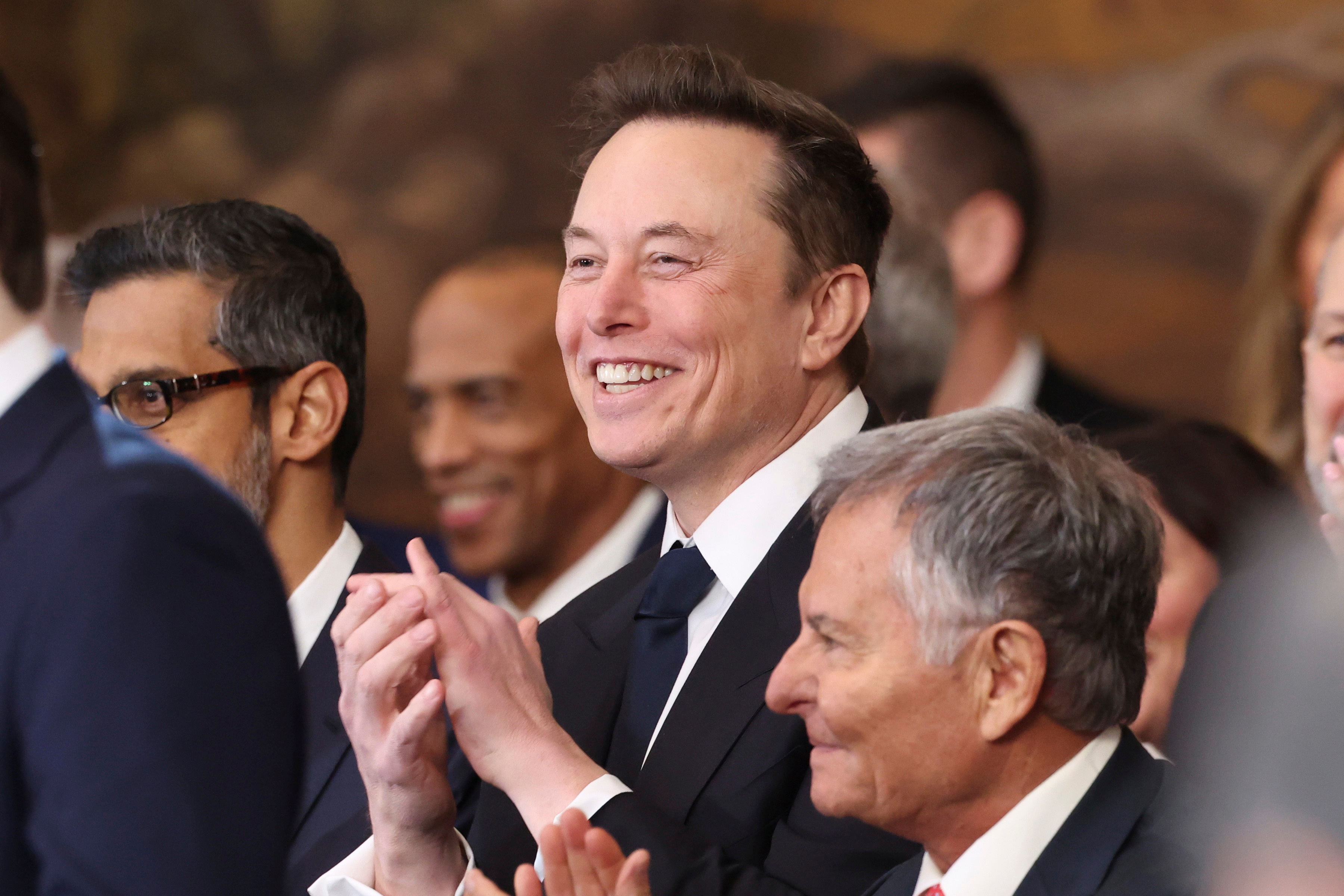 Elon Musk listens as President Donald Trump speaks after taking the oath of office at the 60th Presidential Inauguration in the Rotunda of the U.S. Capitol in Washington, Monday, Jan. 20, 2025.