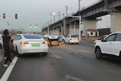 This photo provided by Zhang Yazhou shows her damaged Tesla Model 3, left, which her father was driving when it hit two other cars before crashing to a halt against a concrete barrier in Anyang, a city in central China’s Henan province, on Feb. 21, 2021. Zhang was in the passenger seat. Her mother and her one-year-old niece were at the back.