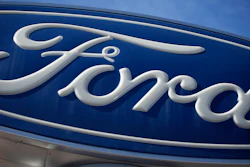 The Ford company logo is seen, Oct. 24, 2021, on a sign at a Ford dealership in southeast Denver.