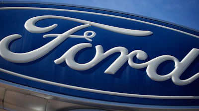 The Ford company logo is seen, Oct. 24, 2021, on a sign at a Ford dealership in southeast Denver.
