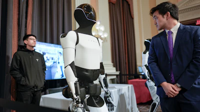 A Tesla robot is displayed as U.S. robotics companies look for congressional support to compete with Chinese companies, on Capitol Hill in Washington, Wednesday, March 26, 2025.