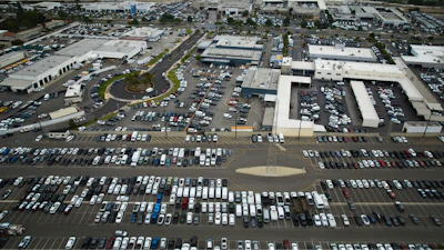 An aerial view shows auto dealerships in Cerritos, Calif., Thursday, March 27, 2025.