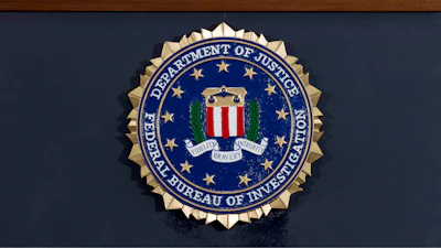 This June 14, 2018 file photo shows an FBI seal on a podium before a news conference at the agency's headquarters in Washington.