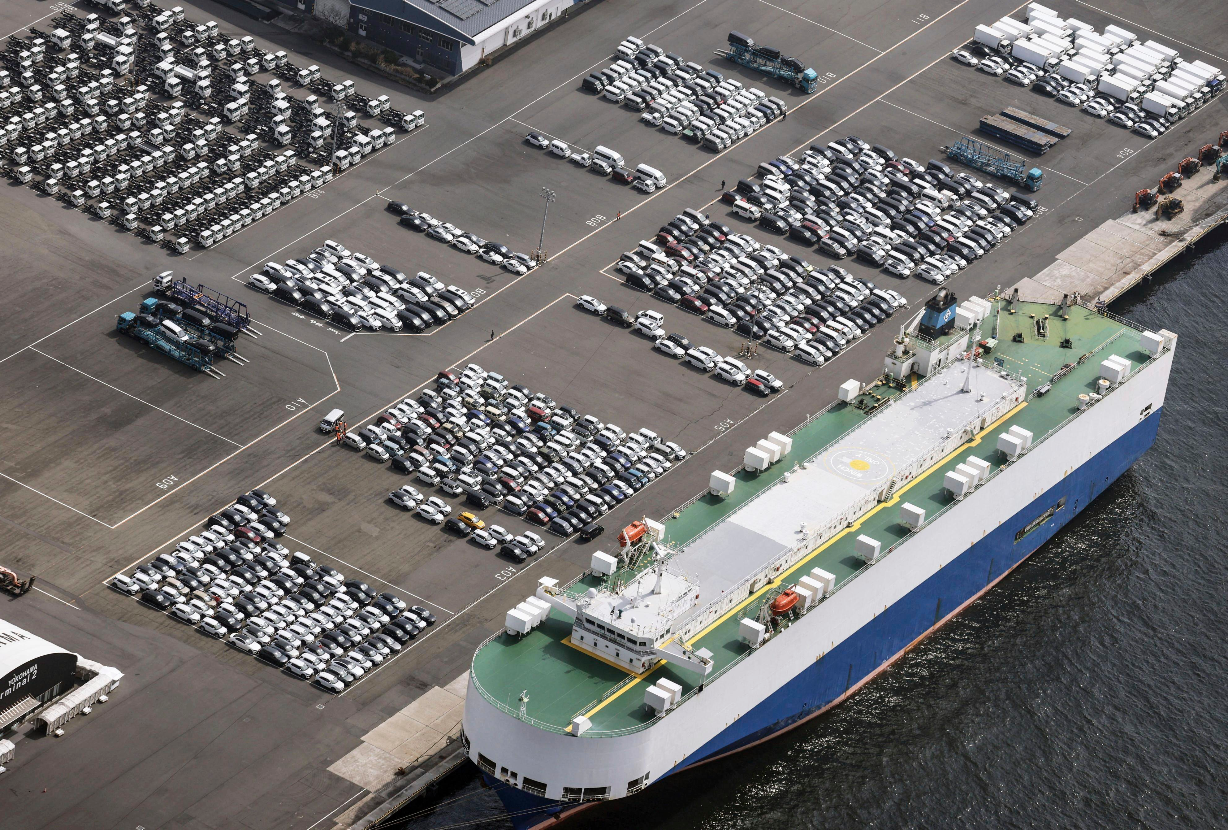 This photo shows vehicles bound for foreign countries at a logistics center in Kawasaki near Tokyo, Thursday, March 27, 2025.