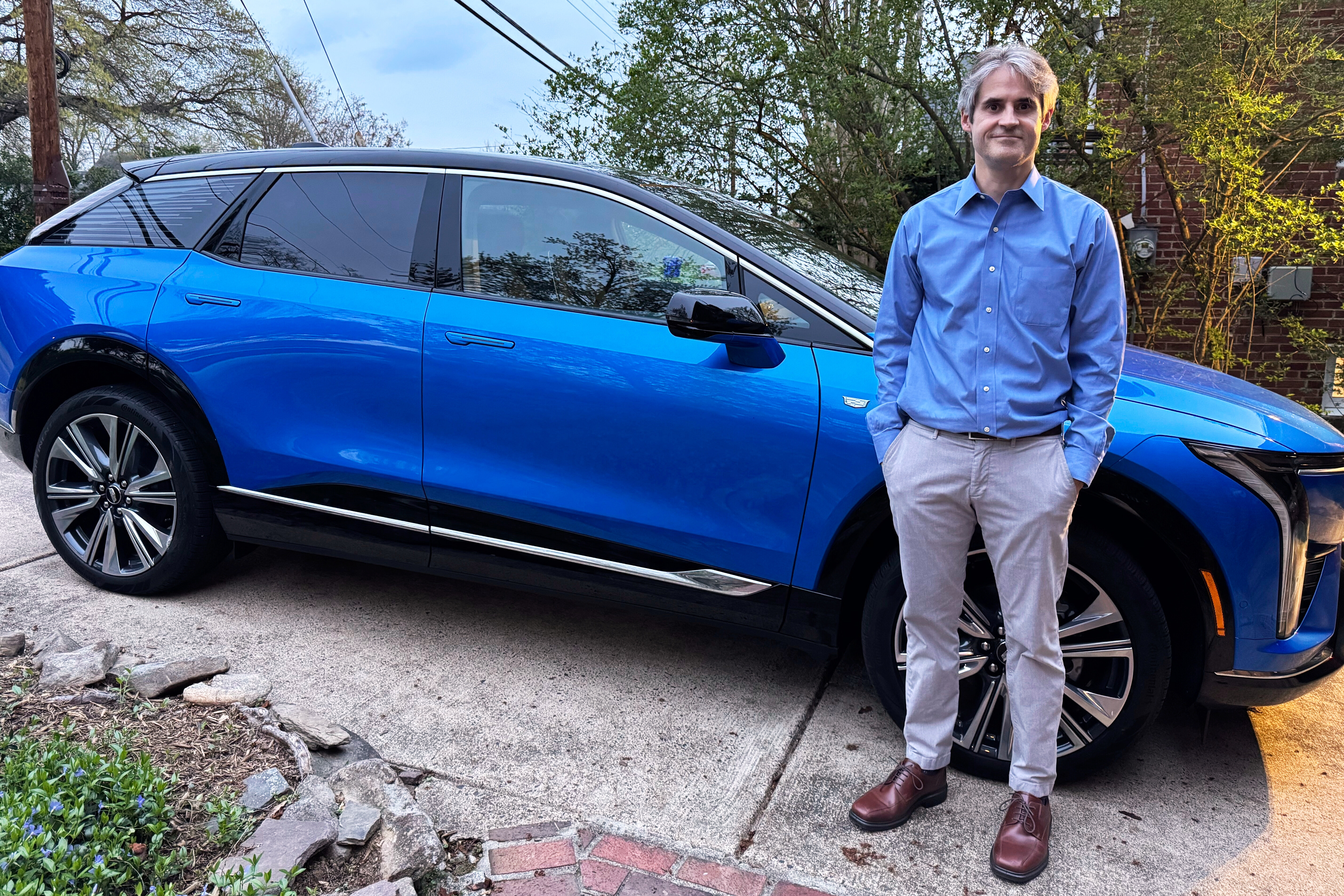 Rob Blackwell stands next to an EV he started leasing right before U.S. President Donald Trump announced expansive new import tariffs, in Richmond, Va., on April 3, 2025.