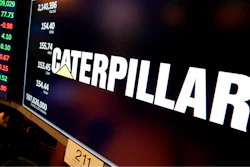 The logo for Caterpillar appears above a trading post on the floor of the New York Stock Exchange, April 23, 2018.