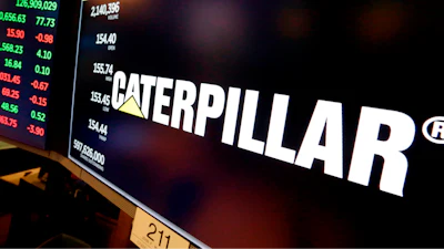 The logo for Caterpillar appears above a trading post on the floor of the New York Stock Exchange, April 23, 2018.