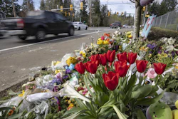 Flowers line a memorial in Renton, Wash., April 2, 2024, near where a speeding motorist crashed into a minivan, killing four people and seriously injuring two.