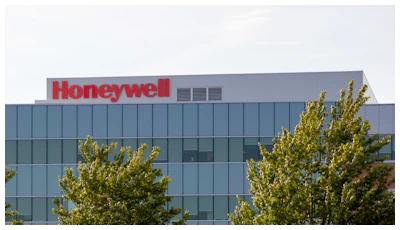 Honeywell corporate headquarters with glass exterior and green trees