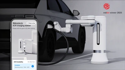 Electric vehicle charging station with smartphone interface and Red Dot Award winner badge