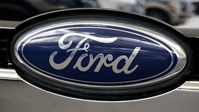 Ford automotive logo on vehicle grille with navy blue oval emblem