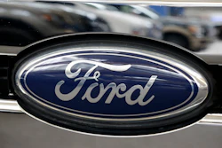 Ford automotive logo on vehicle grille with navy blue oval emblem