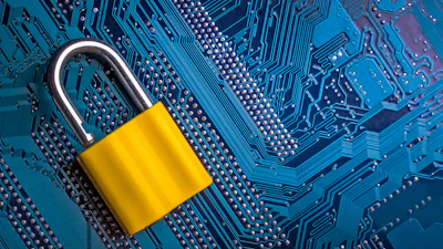 Yellow padlock on blue circuit board symbolizing digital security