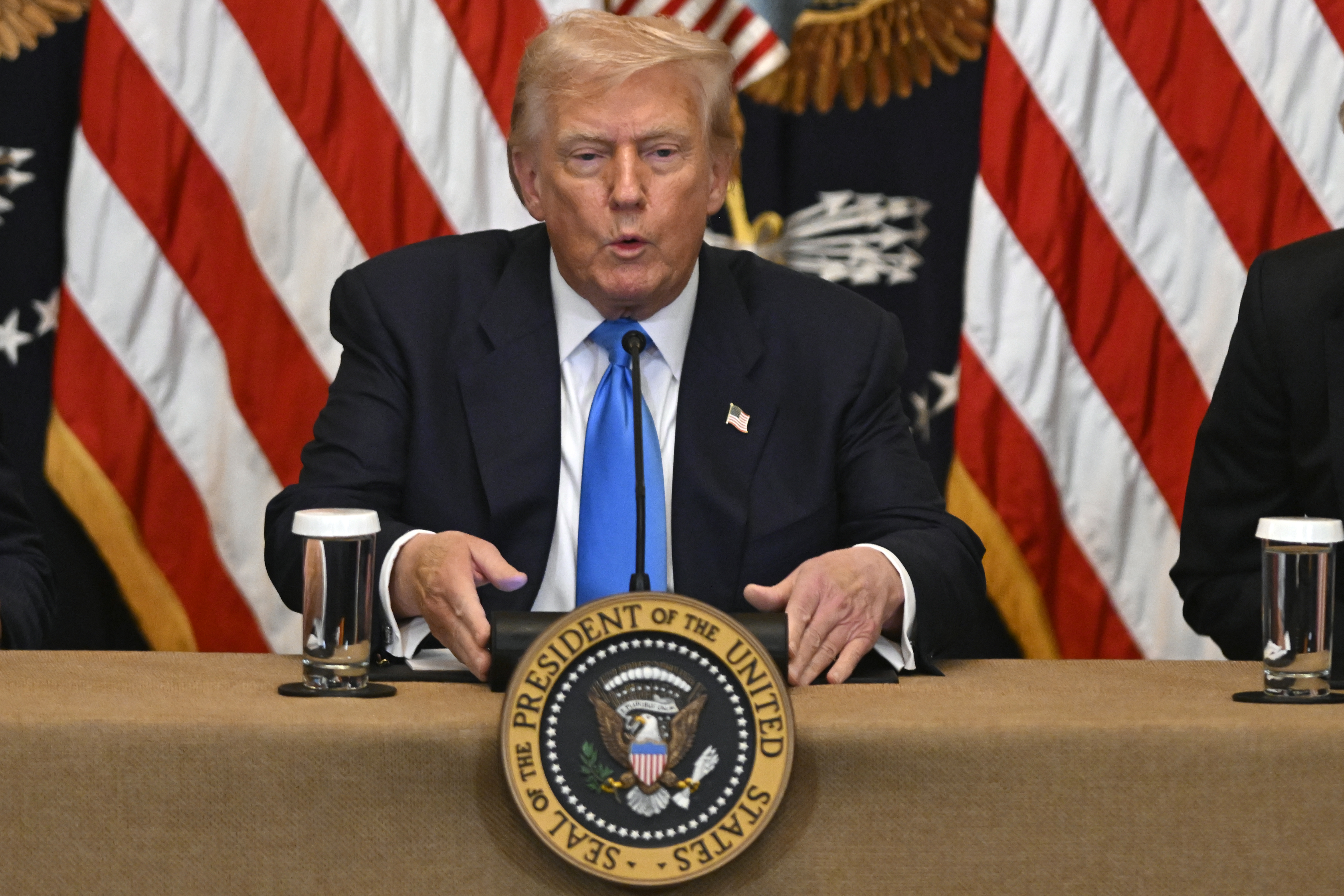 Presidential seal on podium during official government briefing