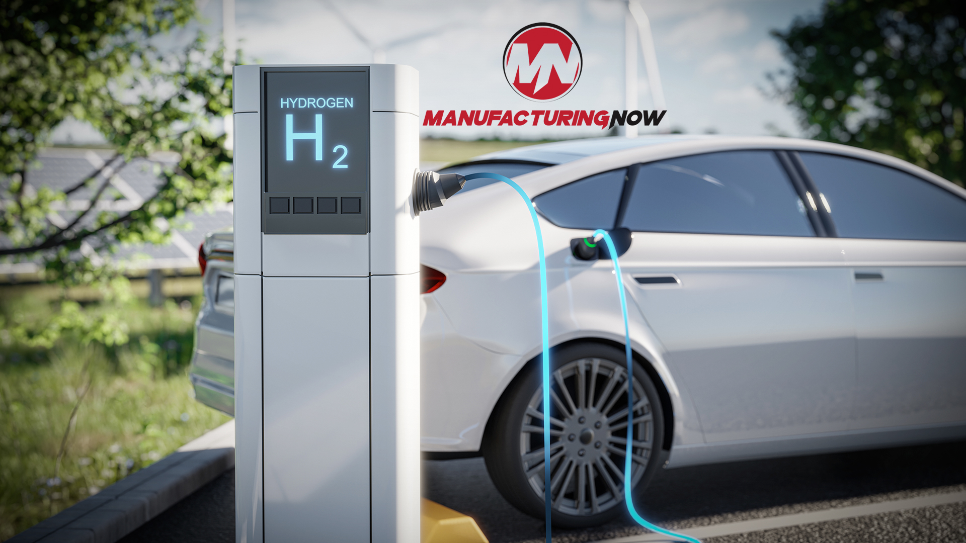 Hydrogen fuel station with white electric vehicle and Manufacturing Now logo
