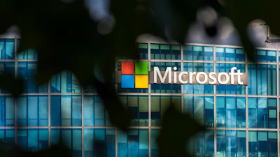 Microsoft headquarters building with corporate logo on glass facade