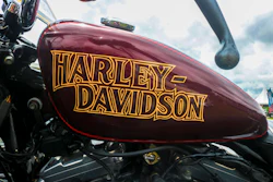 Burgundy Harley-Davidson motorcycle fuel tank with gold lettering