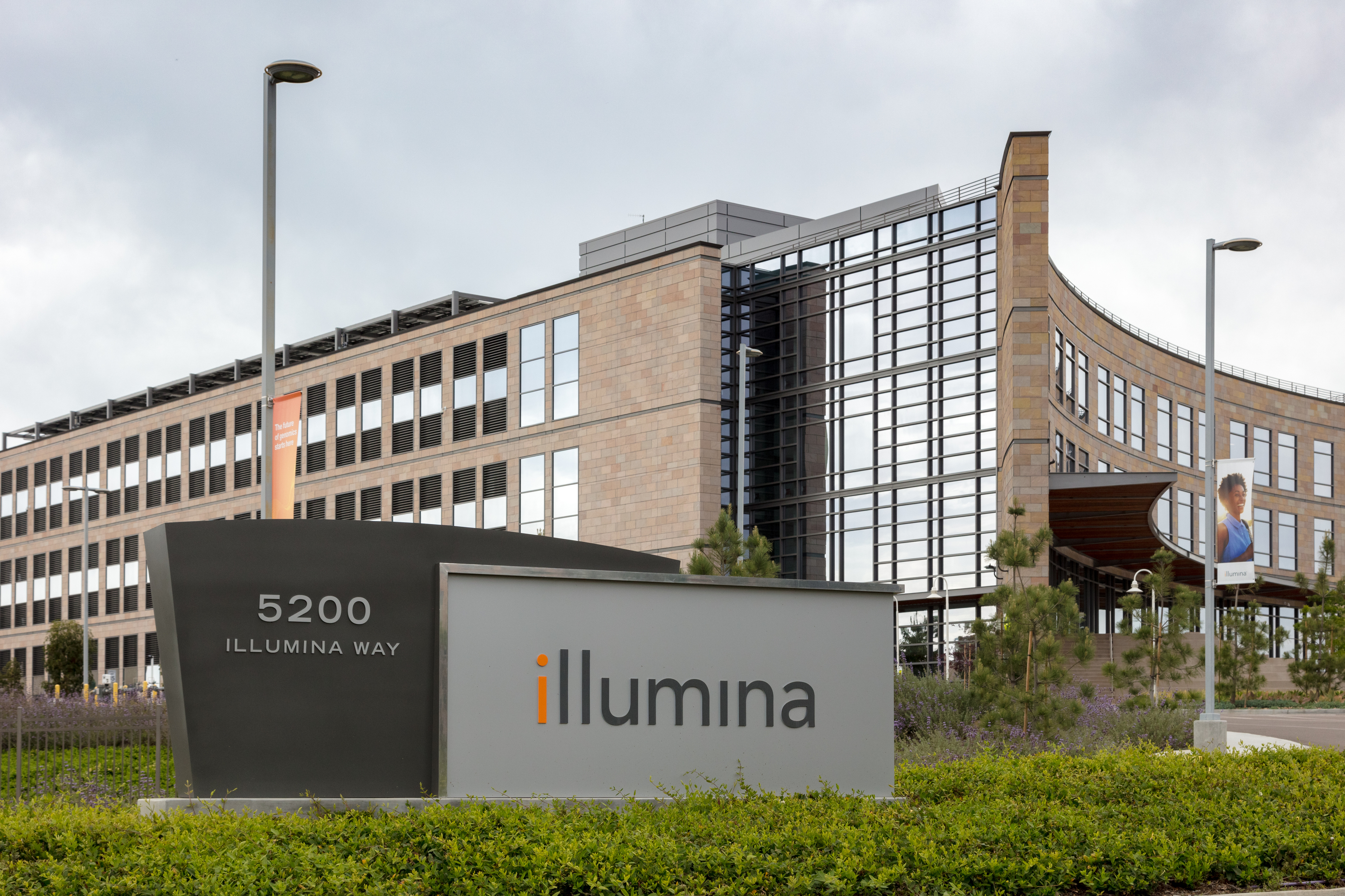 Illumina corporate headquarters with modern glass and stone building and company sign