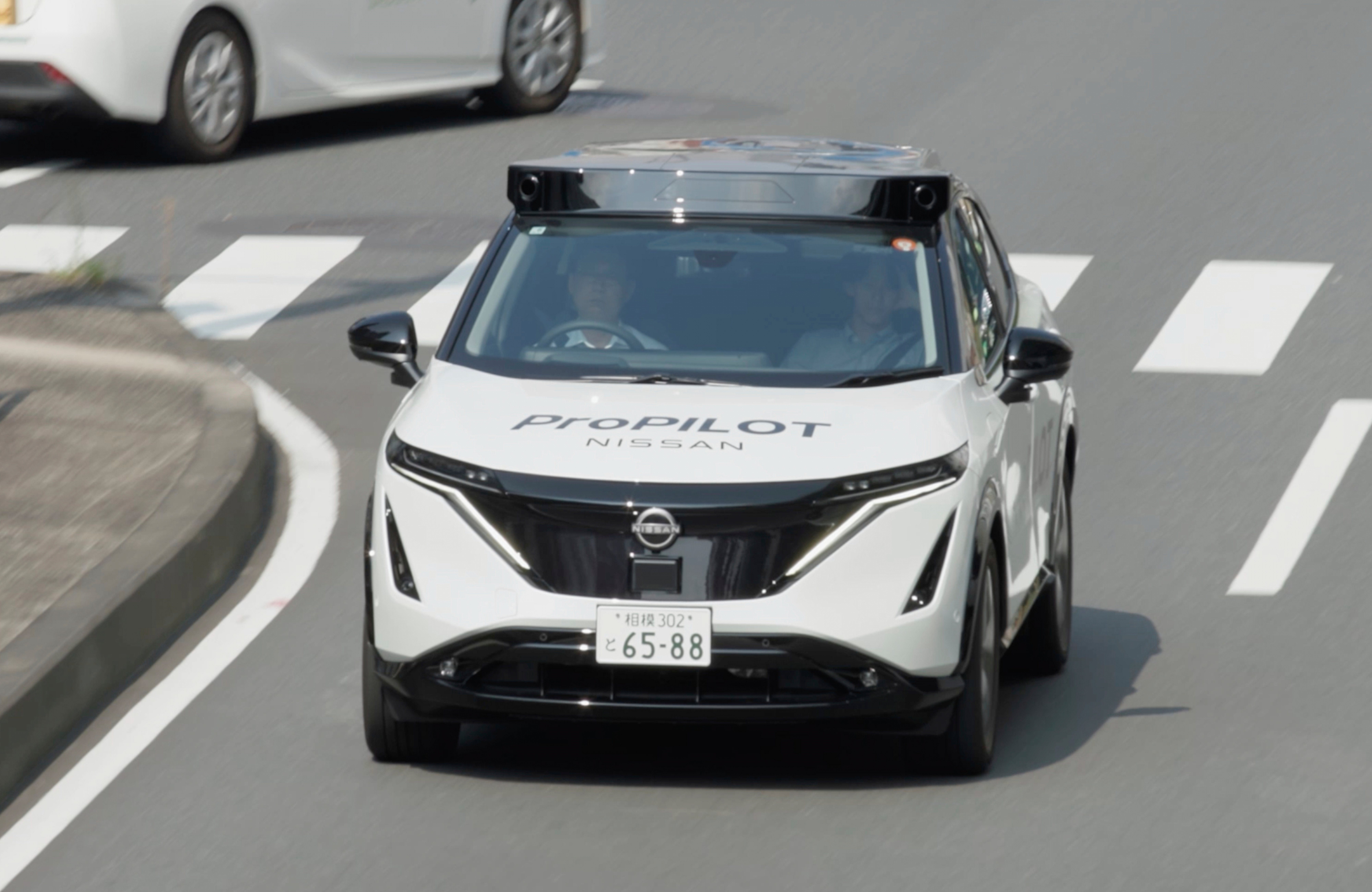 White Nissan autonomous vehicle with Propilot technology on urban road