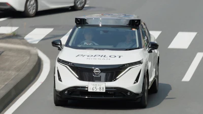 White Nissan autonomous vehicle with Propilot technology on urban road